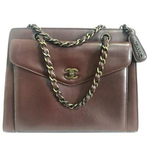 Vintage CHANEL wine chocolate brown leather handbag with copper finished chains and CC closure. Classic and daily use bag., Brown
