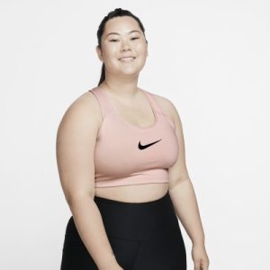 Damski stanik sportowy zapewniający średnie wsparcie z logo Swoosh Nike (duże rozmiary) - Różowy