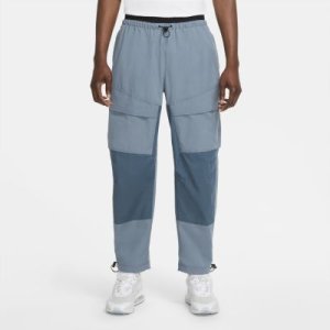 Męskie spodnie z tkaniny Nike Sportswear Tech Pack - Niebieski
