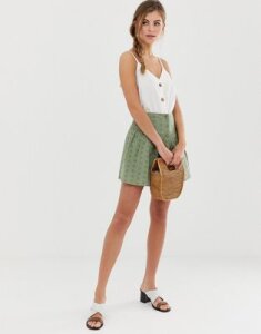 ASOS DESIGN broderie mini skirt with button front-Green