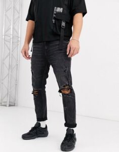 ASOS DESIGN carrot fit jeans in washed black with heavy rips