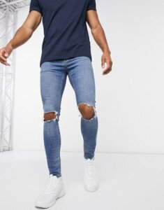ASOS DESIGN Cone Mill Denim spray on jeans with power stretch in vintage mid wash blue with knee rips
