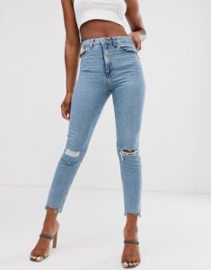 ASOS DESIGN Farleigh high waisted slim mom jeans in light vintage wash with slashed rips & raw hem detail-Blue