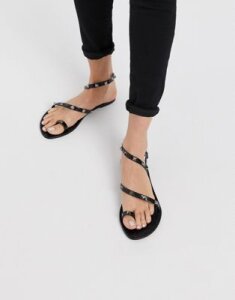ASOS DESIGN Flaunt studded jelly flat sandals in black