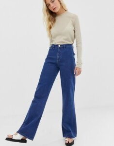 ASOS DESIGN Full length flare jeans with pressed crease and western pockets in mid vintage wash-Blue