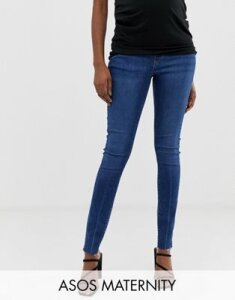 ASOS DESIGN Maternity Ridley high waisted skinny jeans in dark stone wash blue with raw hem detail with under the bump w