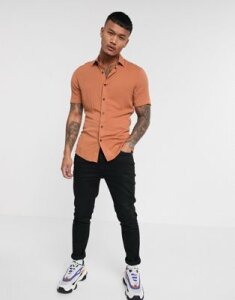 ASOS DESIGN muscle fit viscose shirt in light rust with short sleeves-Orange