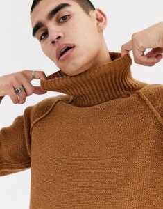 ASOS DESIGN oversized fluffy roll neck sweater with burst seams in tan
