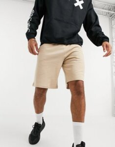 ASOS DESIGN oversized jersey shorts in beige