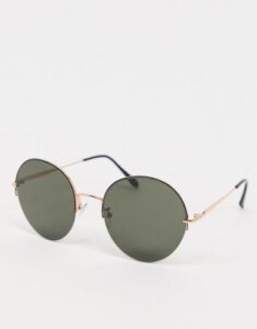 ASOS DESIGN oversized metal round sunglasses in black and gold frame