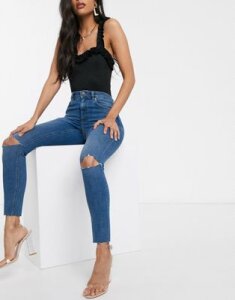 ASOS DESIGN Ridley high waisted skinny jeans in mid blue with rips