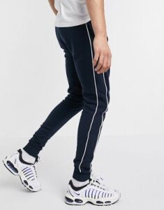ASOS DESIGN skinny sweatpants with piping in navy