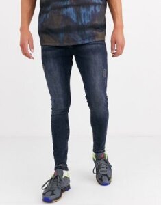 ASOS DESIGN spray on jeans in power stretch with rips and abrasions in blue black