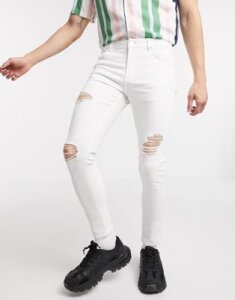 ASOS DESIGN spray on jeans with power stretch in white with heavy rips