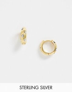 ASOS DESIGN sterling silver with gold plate huggie hoop earrings with polka dot crystals