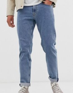 ASOS DESIGN stretch tapered jeans in flat mid wash blue