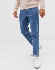 ASOS DESIGN stretch tapered jeans in retro mid wash blue