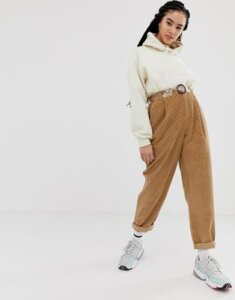 ASOS DESIGN tapered boyfriend jeans with curved seams in brown diamond cord with plastic belt