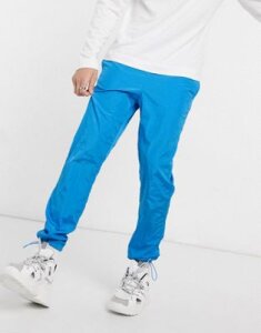 ASOS DESIGN tapered sweatpants in blue nylon