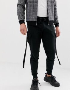 ASOS DESIGN tapered sweatpants with cargo pockets and strapping-Black