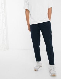 ASOS DESIGN tapered sweatpants with pleats in navy