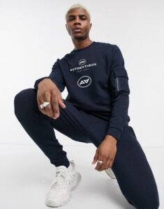 ASOS DESIGN tracksuit with skinny jogger and authentique print-Navy