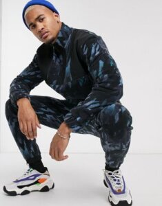 ASOS DESIGN two-piece slim sweatpants with camo fleece and nylon panels-Blue