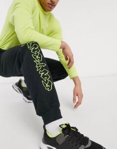 Entente sweatpants in black with neon logo