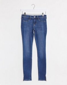 Hollister mid rise skinny jeans in mid blue wash