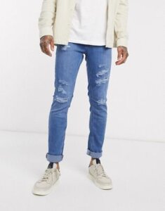 Jack & Jones Intelligence slim tapered fit ripped jeans in mid blue