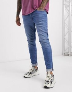 Levi's skinny tapered fit jeans in amalfi pier dark wash-Blue