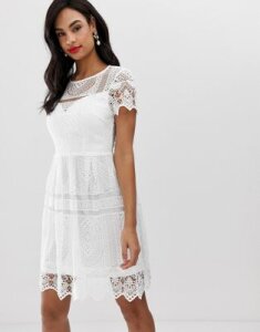 Liquorish lace overlay mini dress with open back-White