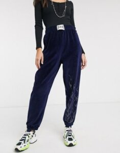 New Girl Order relaxed sweatpants in velvet with rhinestone flame detail-Blue