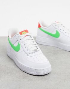 Nike Air Force 1 '07 sneakers in white with neon swoosh
