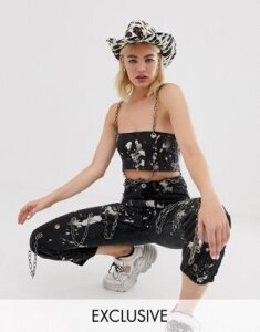 One Above Another bandeau top with chain straps in paint splatter denim-Black