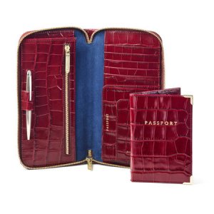 Aspinal Of London - Zipped travel wallet with passport cover in deep shine bordeaux croc